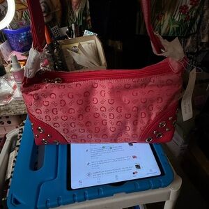 Vibrant pink studded shoulder bag